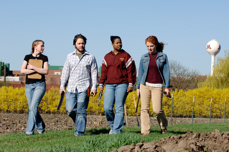 Four University of Minnesota students walking
