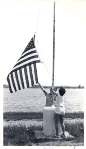 Person raising flag